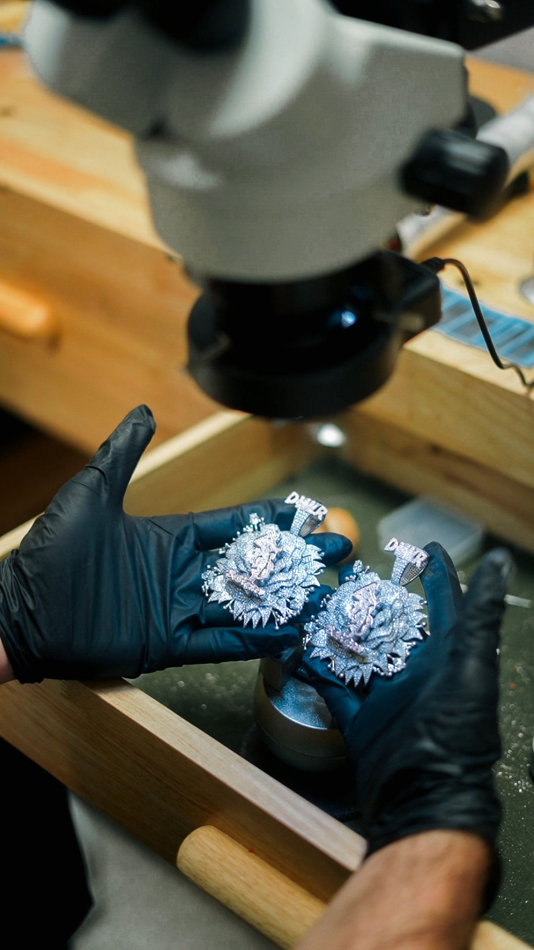 Custom diamond pendants under the microscope